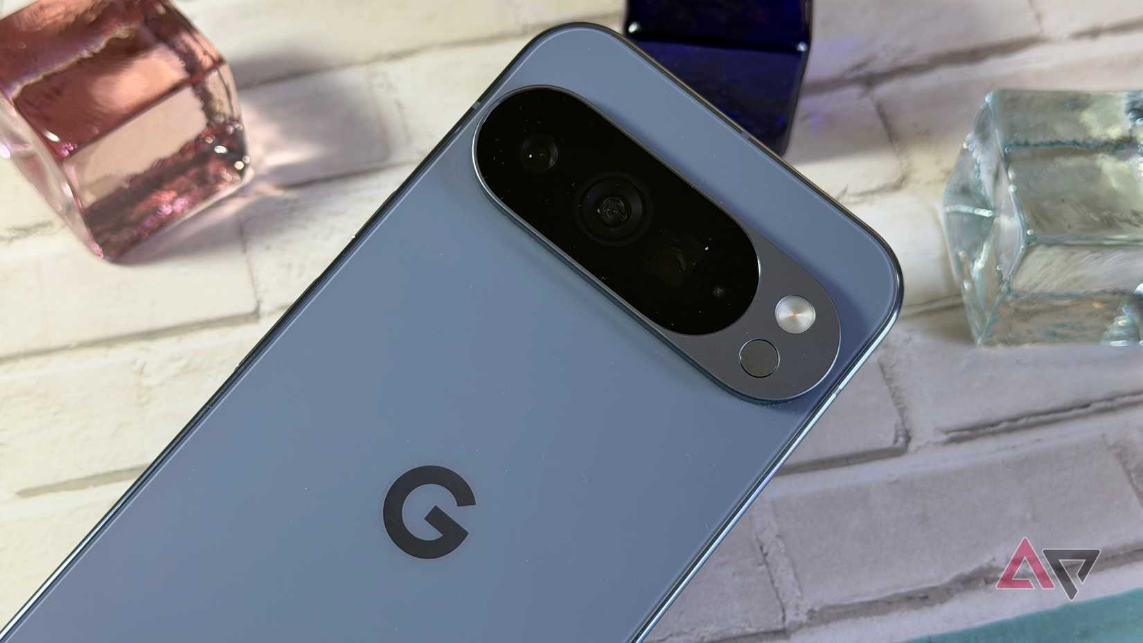Google Pixel 10 Pro XL against some glass beads with light from a window